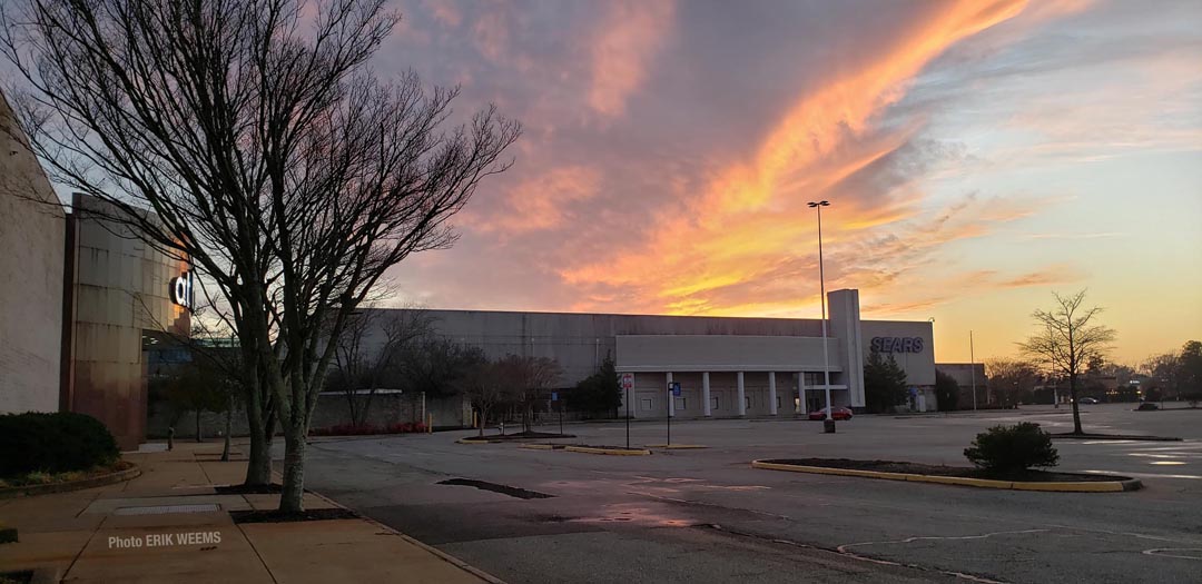 Sunset over empty Sears Store at Mall